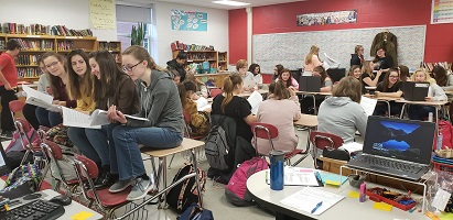 Junior High Readers Theatre club rehearsing an upcoming play during activity period.