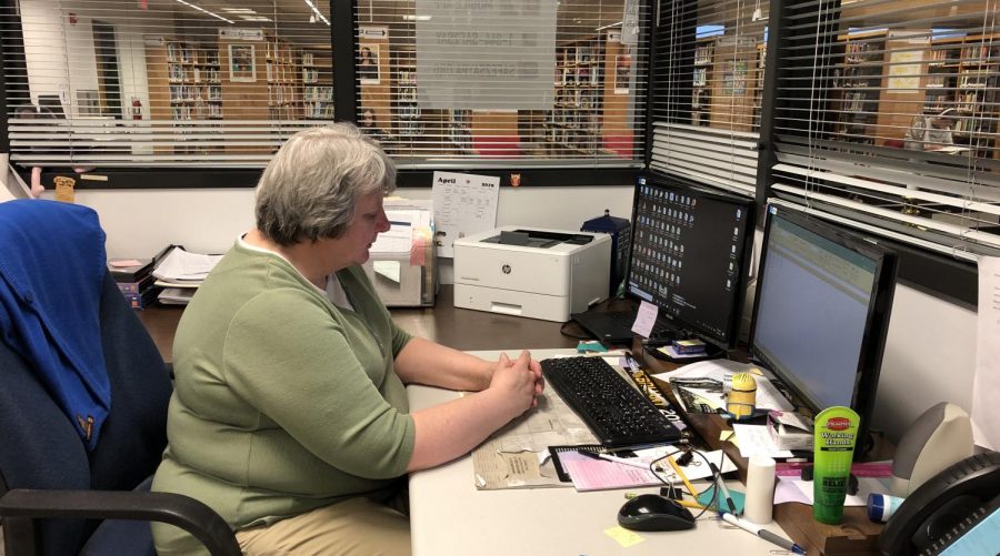 Mrs. Brady working hard at her desk