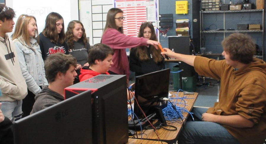 Students test out equipment in the IT lab.