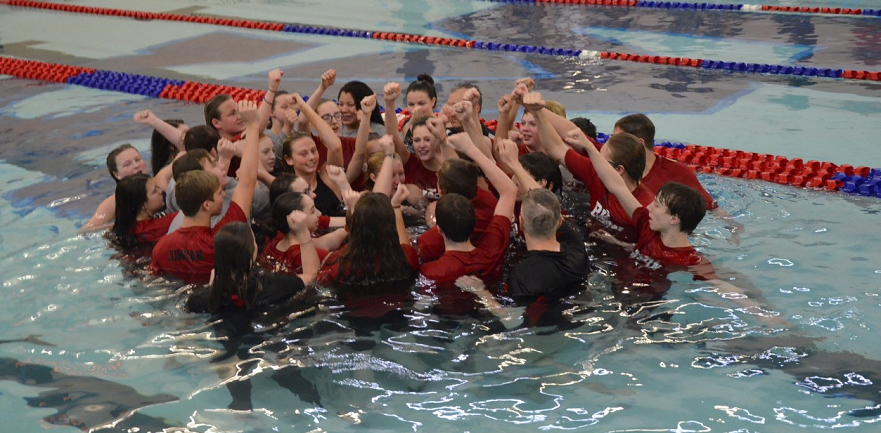 The+Clearfield+Swim+Team+celebrates+after+both+teams+win+District+IX+title.