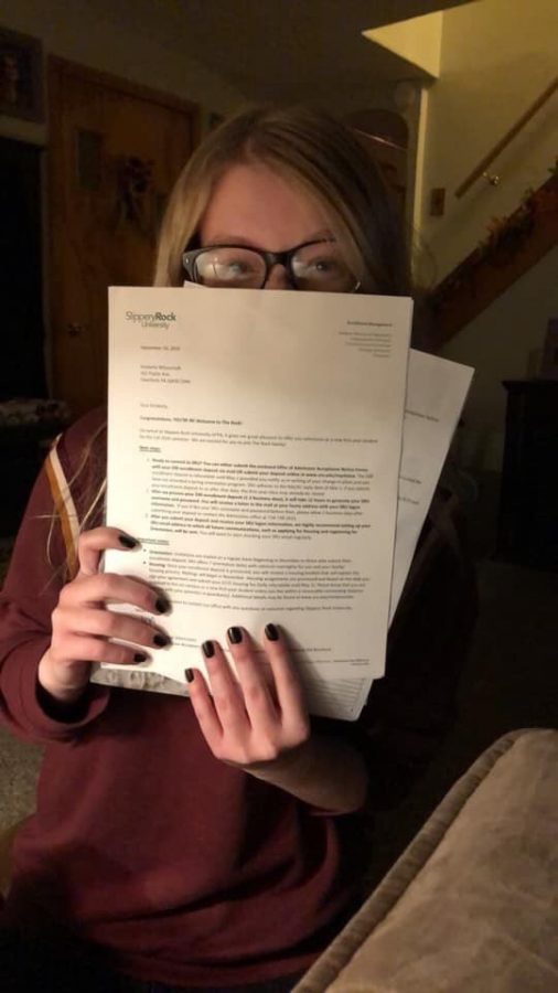 Kimberly Wilsoncroft holds her acceptance/ scholarship letter.