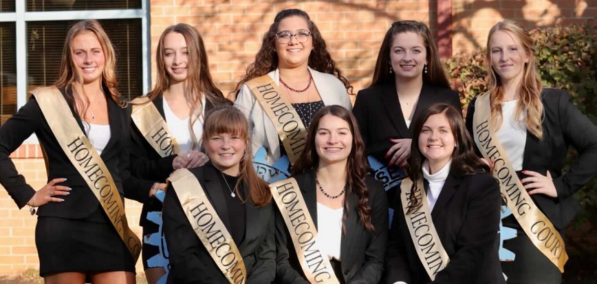 Homecoming court sitting in front of the Shaw Public Library. Shown, from left, are, front row: Charlise McSkimming, Emily Hanes, and Kendhyl Luzier; and back row: Karli Bietz, Sydney Salvatore-Trinidad, Homecoming Queen Rylee Biancuzzo, Megan Durandetta, and Morgan Cheek.