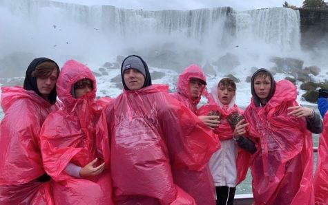 Friends pose in front of Canadian Horseshoe Falls