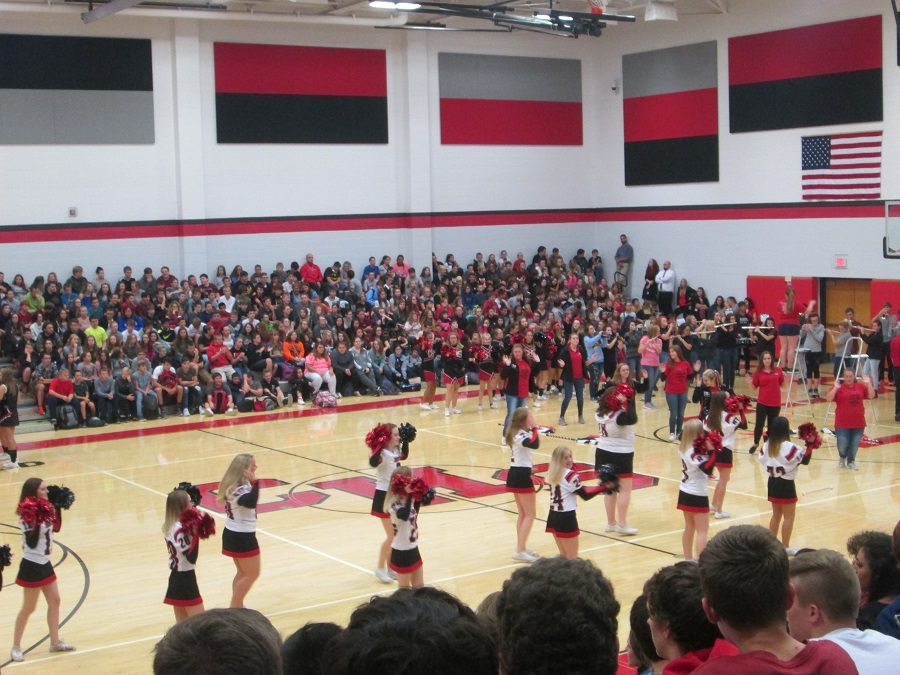 Cheerleaders, band , and majorettes perform