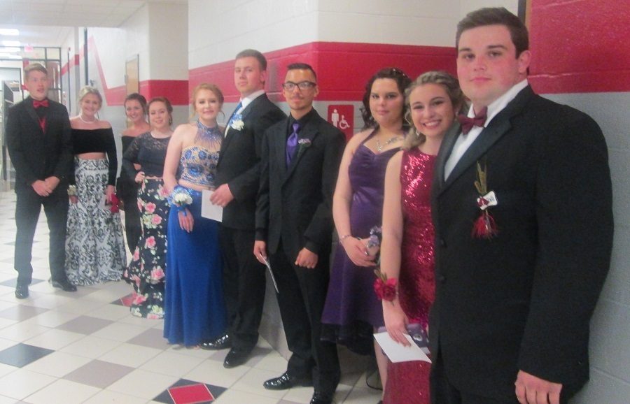 Couples line up for the Promenade prior to the prom.