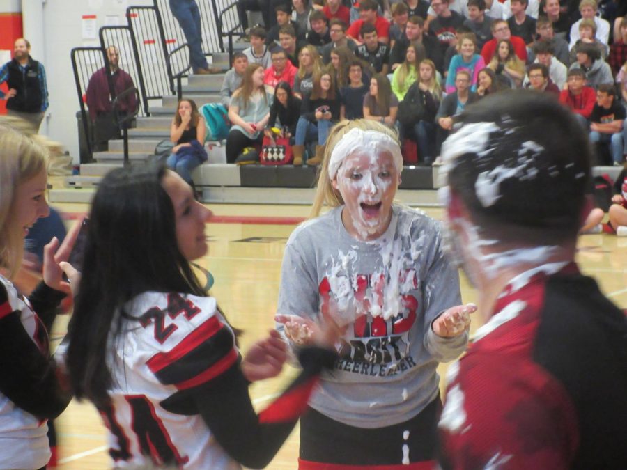 Taylor Martin getting pied in the face by Spencer Graham