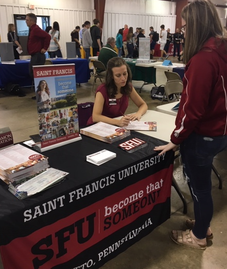 Saint Francis University Transfer Coordinator Kelly Aharrah informs Lauren Coleman about the university