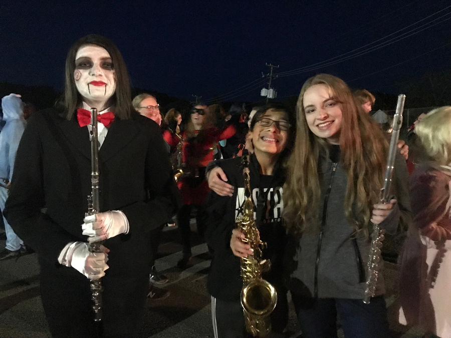 Emmalynne Groth is dress up as Saw next to Devin Destanis and Katelynn Smith.