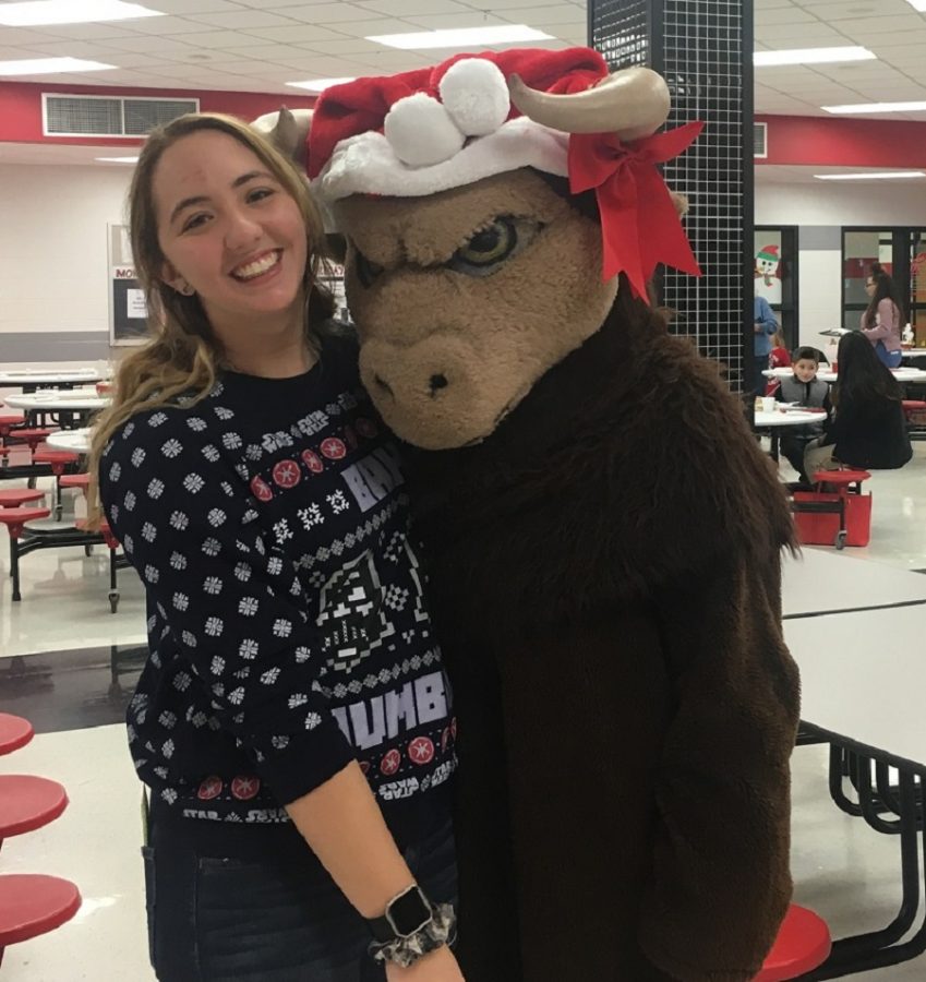 Madilyn Domico poses with Benny the Bison. 