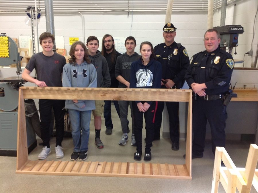 From left to right: Justin Hand. Martin Daub, Matt Brown, Matt Stiner, Tyler Olsen, and Briana Miller.  Also pictured: Officer Marshall and Chief Doug Clark. 