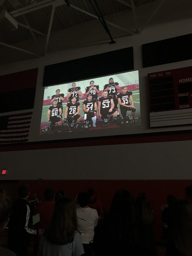 Students enjoy a slide show of the senior football players and much more.