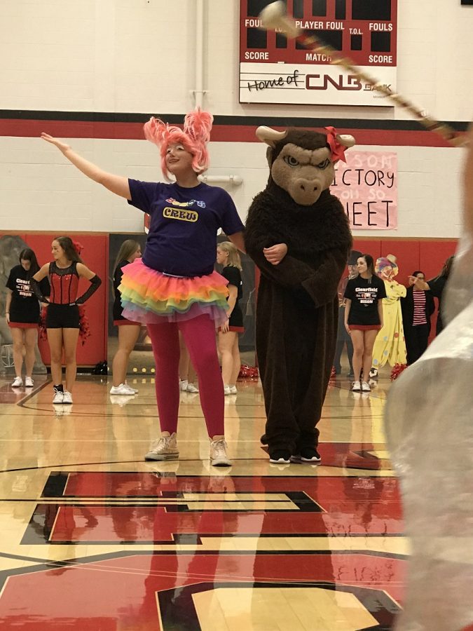 Emma Powell escorts Benny the bison to the Pep Rally