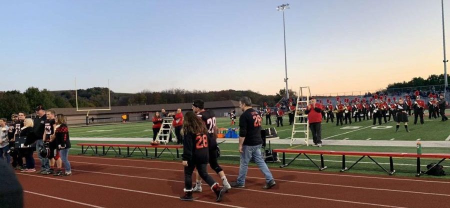 Football players recognized for Senior Night.