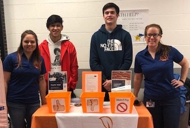 Student council members Crae Ruiz and Cade Walker are helping the members of the Healthy Body  Project collect their data on the carrot fries. 