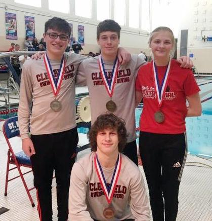 Nick Unch, Jazlynn Shomo and Corbin Turner gather around Justin Hand, back row in the middle, who qualified for states in diving.