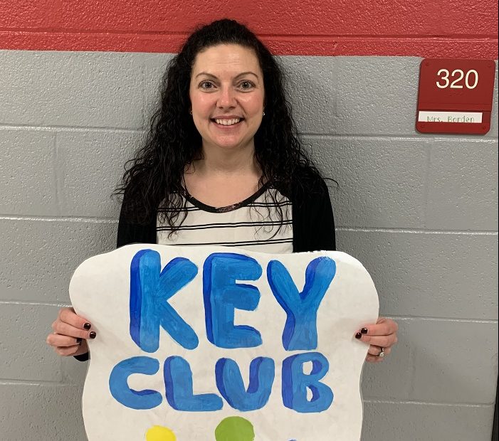 Mrs. Borden, one of the Key Club advisors with her Key Club sign. 