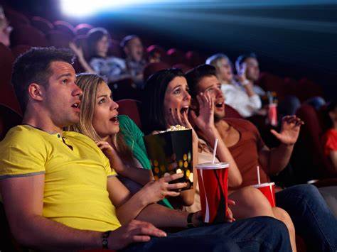 Audience watching a horror movie in a movie theater. (Source: 123RF.com)