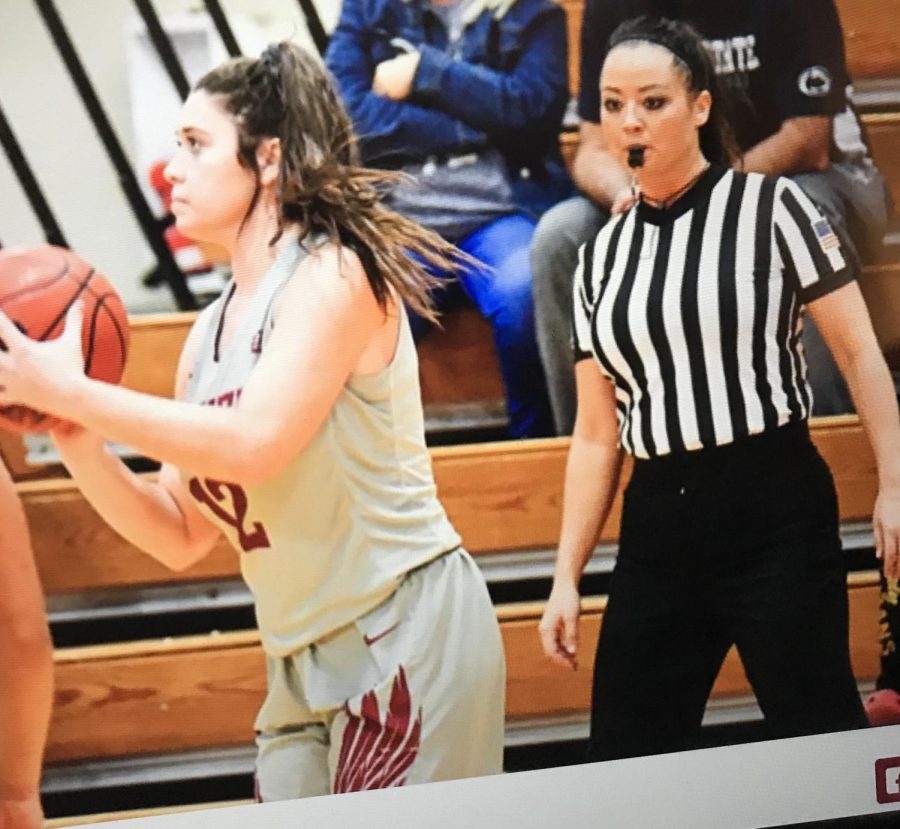 Mrs. Fye officiating basketball.