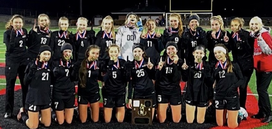 The girls Varsity soccer winning the District 9 title for year 2020