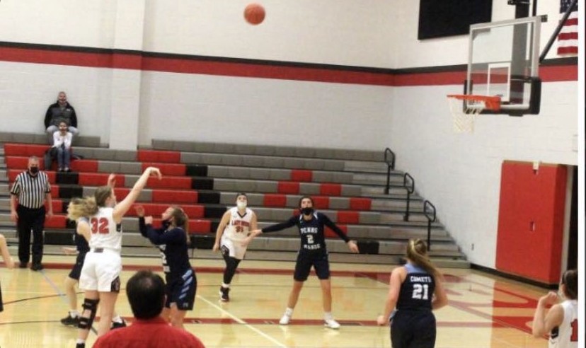 Paige Rhine takes aim during a recent basketball game.