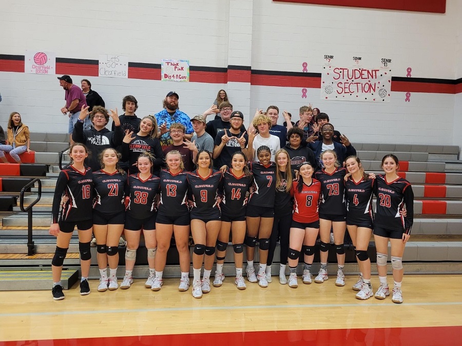 The volleyball team shown with the student section. 