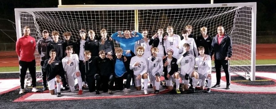 The boys team poses for a picture after their semifinal game against DuBois.