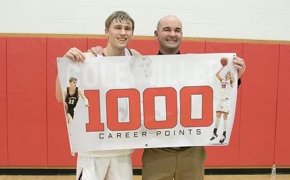 Cole Miller and Coach Glunt celebrate 1,000 points.