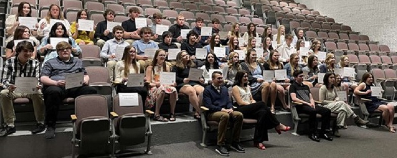 Shown with the newly inducted members of the Clearfield Chapter of the National Honor Society are this years officers, front row, from left: Shane Coudriet, Elizabeth Ryan, and Madison Wanamaker.