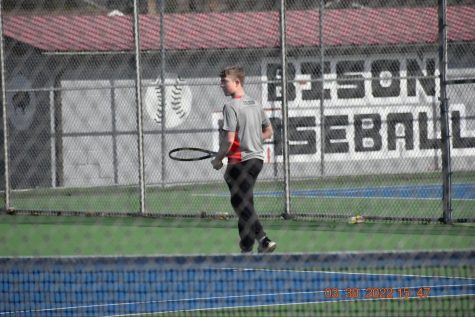 Ethan Evilsizor playing tennis. 