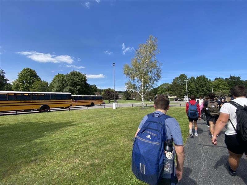 Buses and students landscape photo outside of Clearfield High School, Fall 2024